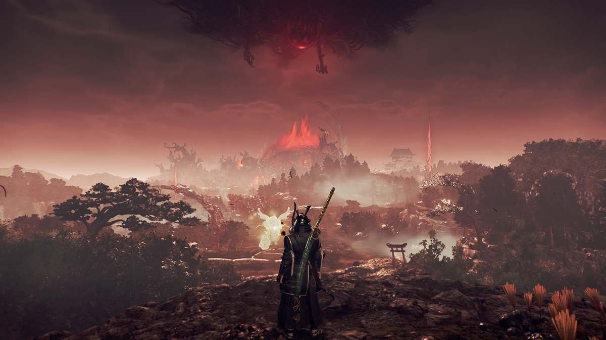 Nioh 3 gameplay screenshot showing the samurai protagonist overlooking a burning, yokai-infested landscape in feudal Japan